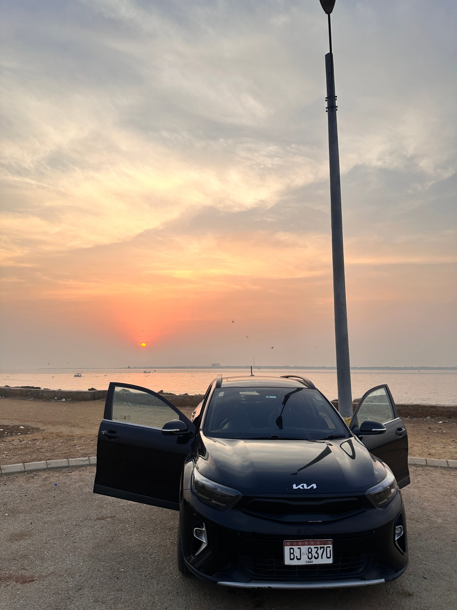 Black Kia at sunset — my favourite car of all time
