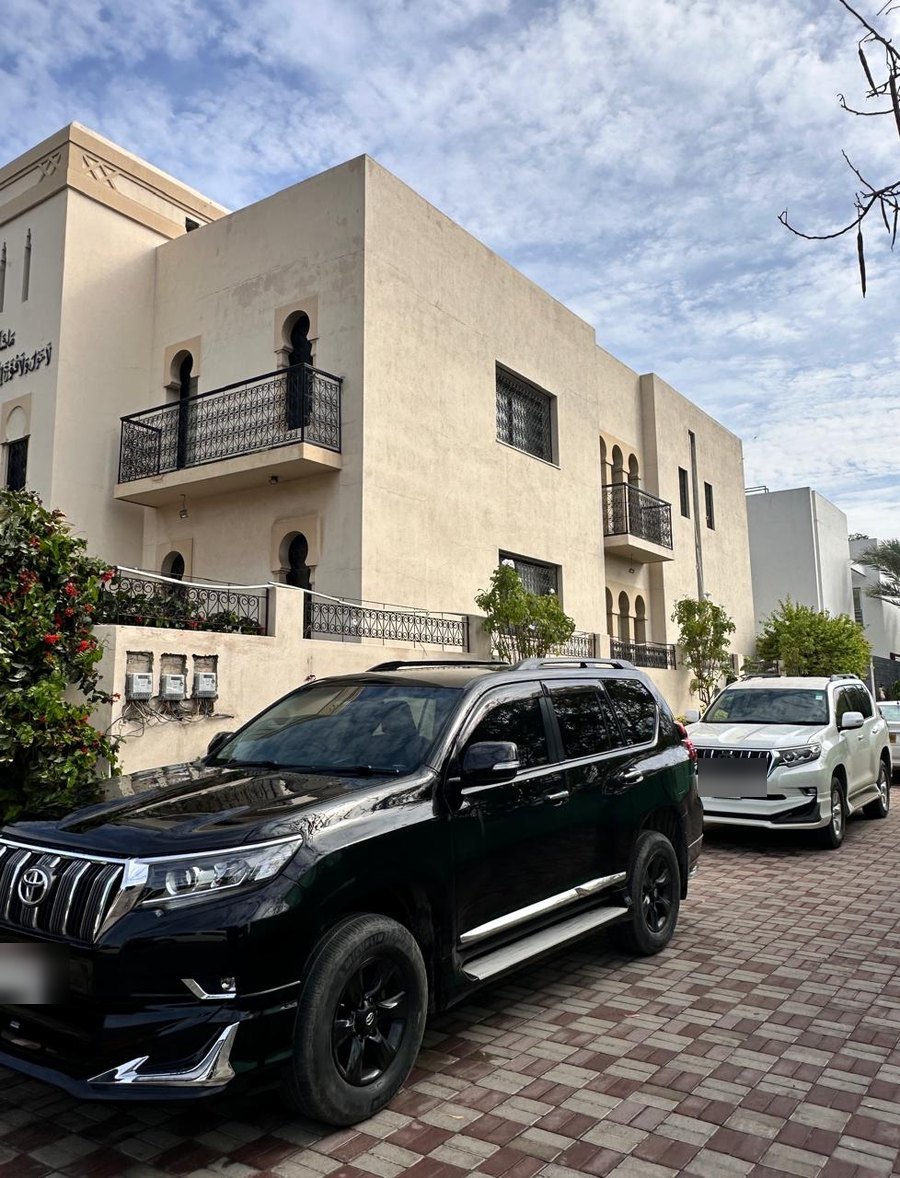 Black Toyota Prado parked outside